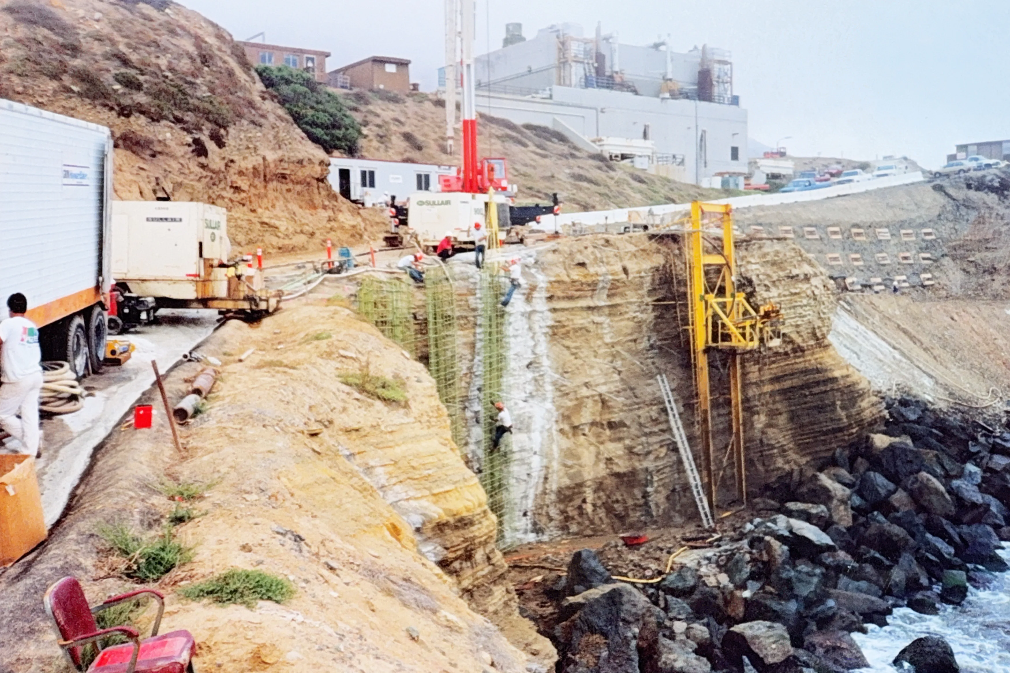 Point Loma bluff stabilization with cranes and rebar reinforcement