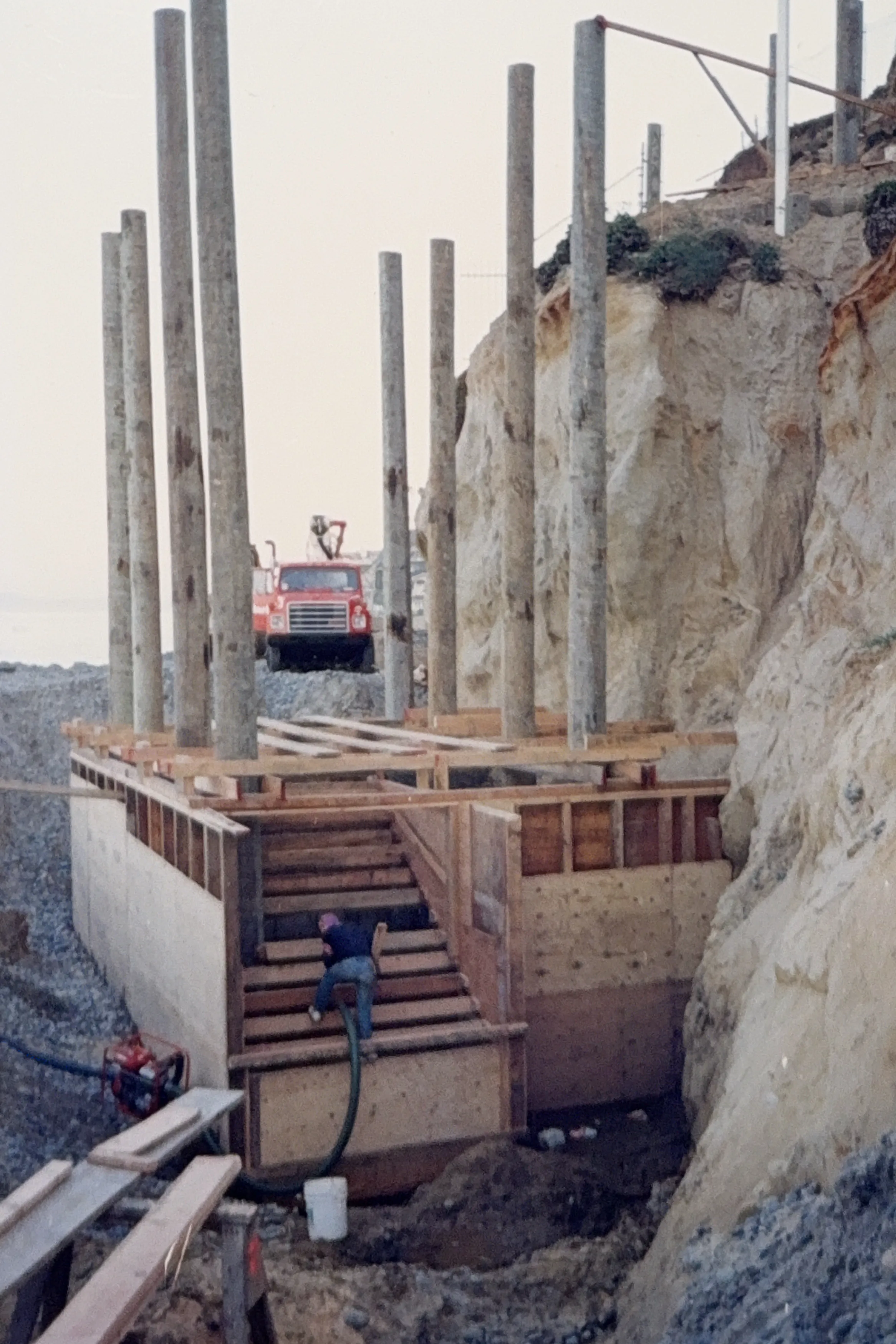 Swami’s coastal access stairway construction with concrete piers